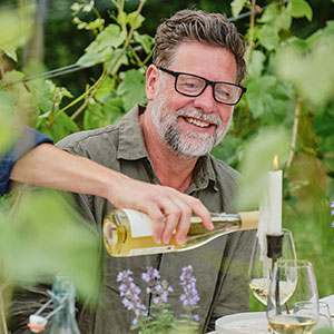 A guest enjoying a glass of Siegerrebe from Wythall Estate 